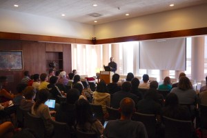Minister Faust reads to his audience.