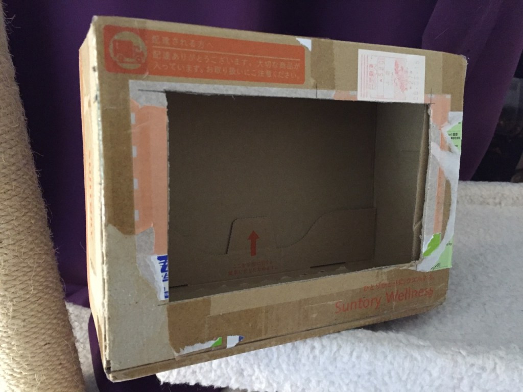 To complete the project, I cut a hole into a Suntory shipping box from Japan that is the exact same size as the 7" Touchscreen Display box, which would work well, too. It is works well for holding up the Raspberry Pi and storing its accessories when I go between home and work.