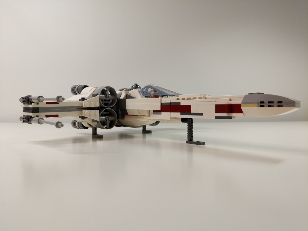LEGO X-Wing modified with detailed wingtip blasters and retractable landing gear.