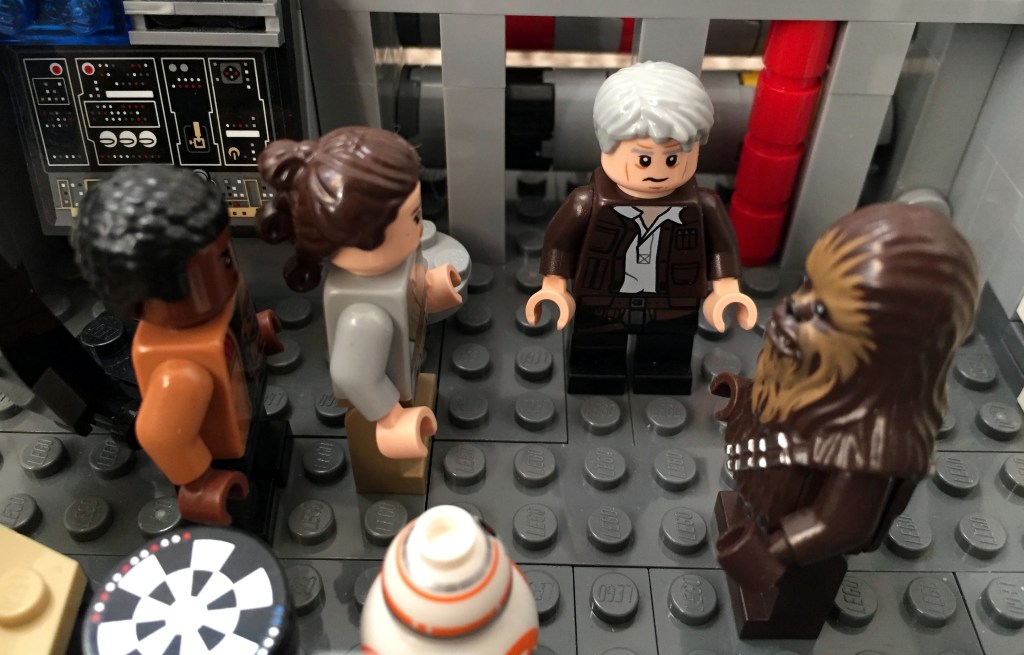 Finn, Rey, BB-8, Han Solo, and Chewbacca standing in the hold of the Millennium Falcon (LEGO MOC).