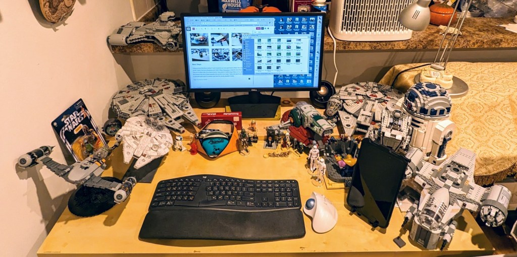 My desk at home--two LEGO Millennium Falcon sets flank my LCD monitor.