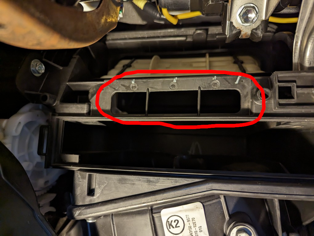 2013 Toyota Corolla cabin air filter assembly missing foam cover for duct above filter.