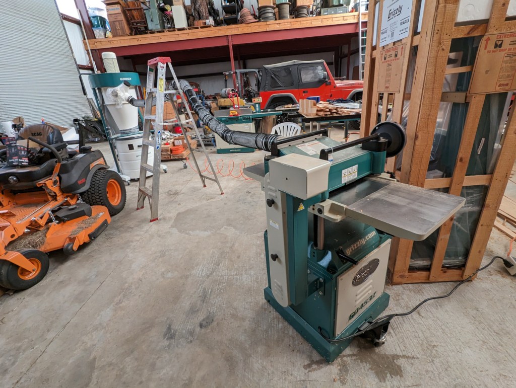 Planer in the foreground. Dust collector in the background.