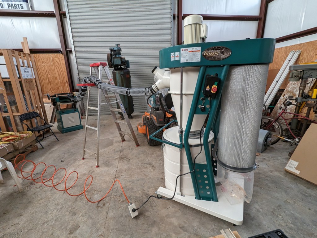 Dust collector in the foreground. Planer in the background.