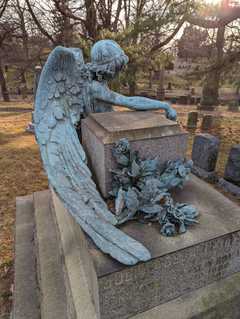 Benjamin Franklin Romain memorial with bronze angel statue in repose. In Green-Wood Cemetery, Brooklyn, New York.