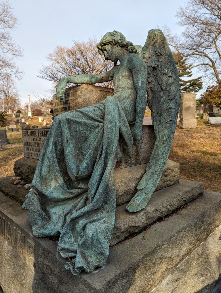 Benjamin Franklin Romain memorial with bronze angel statue in repose. In Green-Wood Cemetery, Brooklyn, New York.