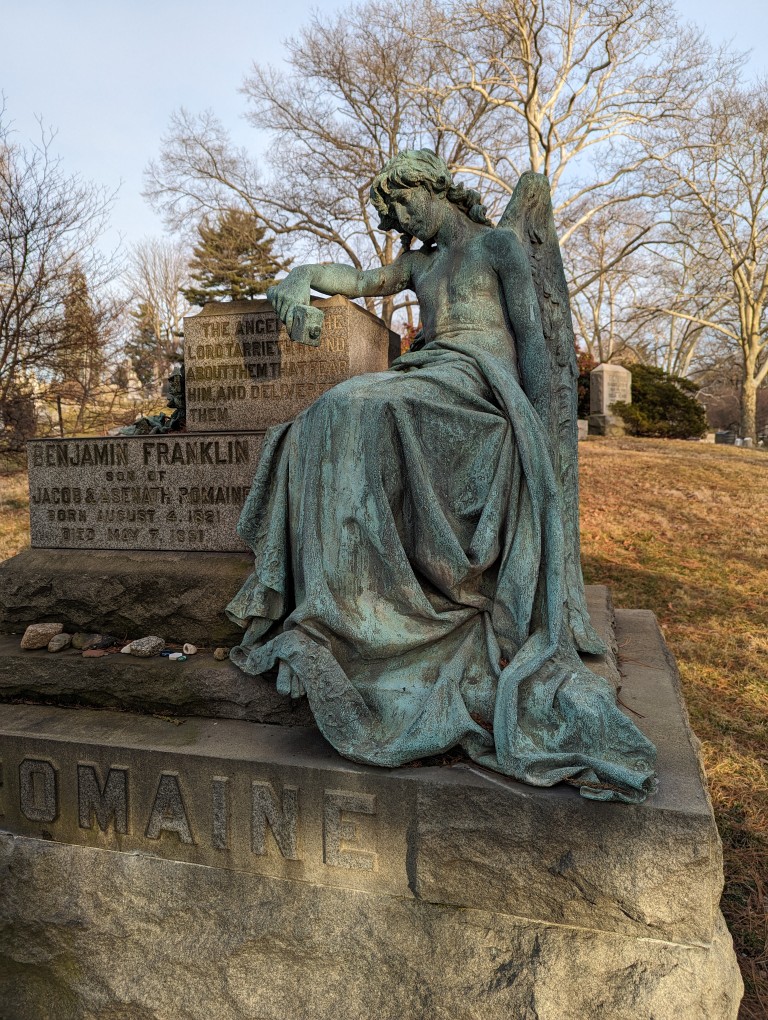 Benjamin Franklin Romain memorial with bronze angel statue in repose. In Green-Wood Cemetery, Brooklyn, New York.