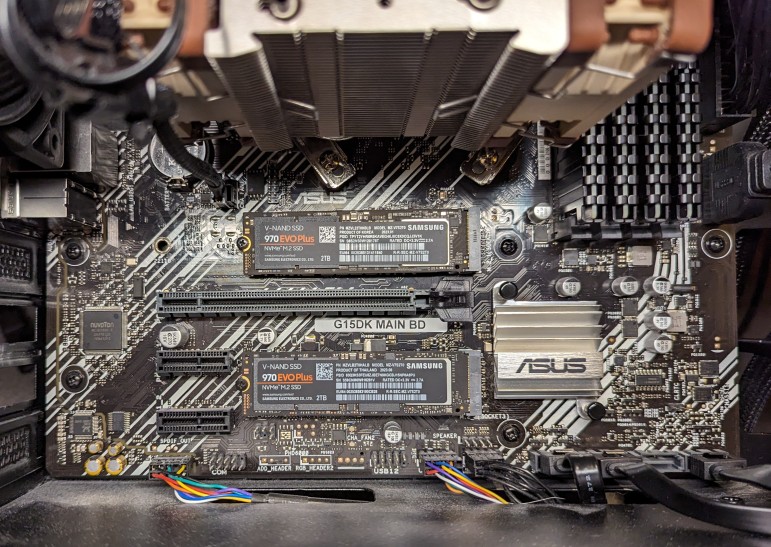 Inside a computer with 2 Samsung 2TB 970 EVO Plus NVMe m.2 SSDs installed on a micro ATX motherboard