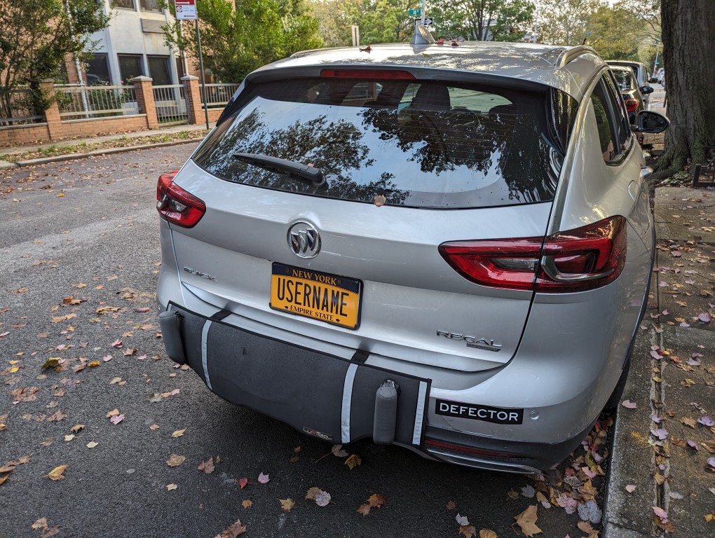 Buick hatchback with a New York license plate with the word "USERNAME"