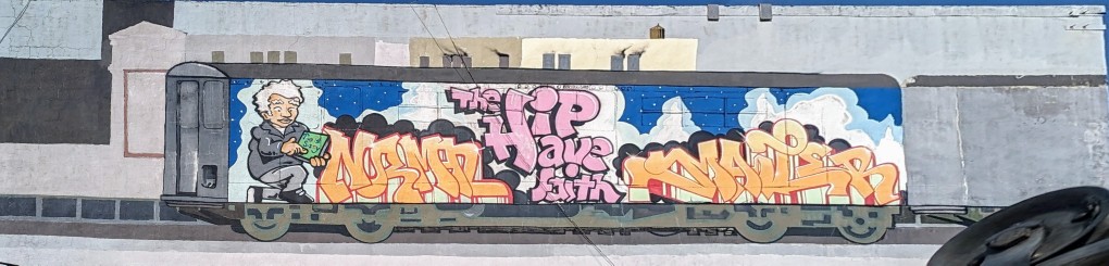Norman Mailer subway car street art mural on 3rd Avenue in Brooklyn