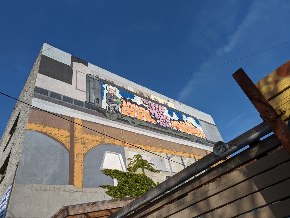 Norman Mailer subway car street art mural on 3rd Avenue in Brooklyn