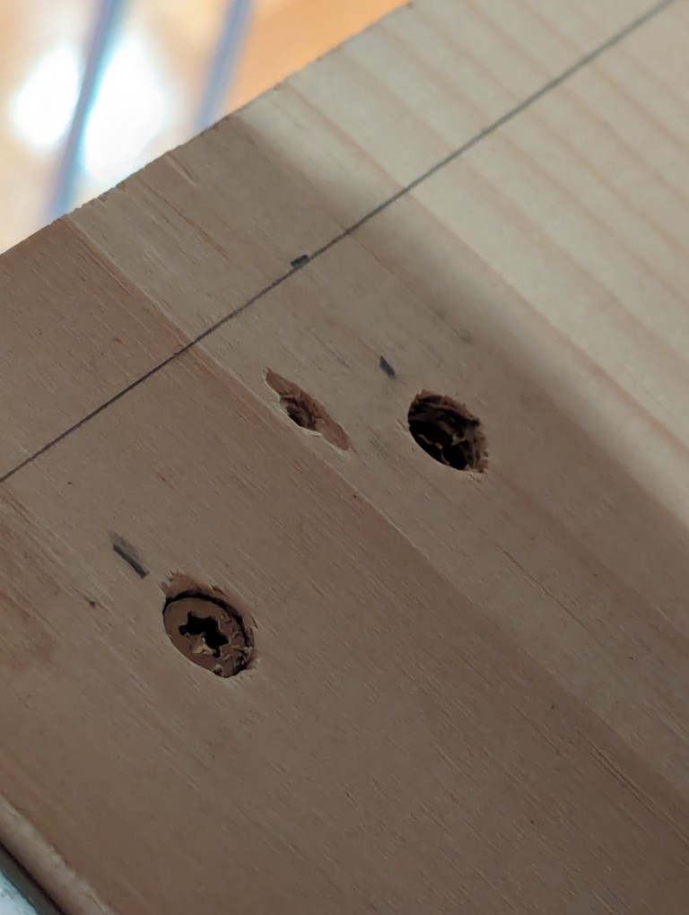 1 7/8" deck screws driven through a 1" x 12" x 48" board