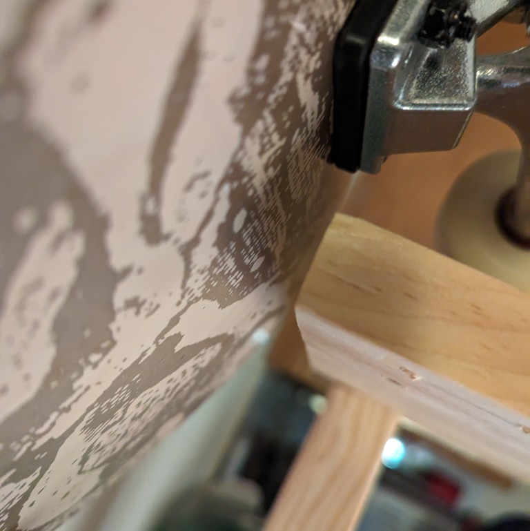 1/2" clearance between edge of shelf and skateboard hanging on the adjacent wall