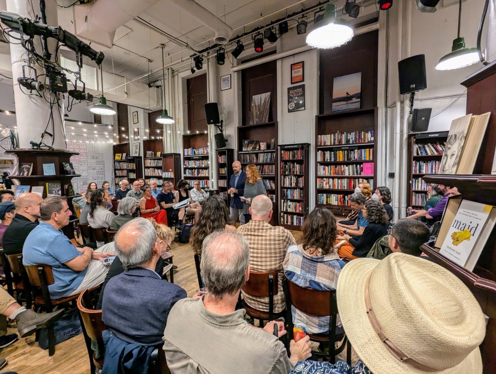 Sheila Williams and Trevor Quachri speaking to a seated crowd in a bookstore.