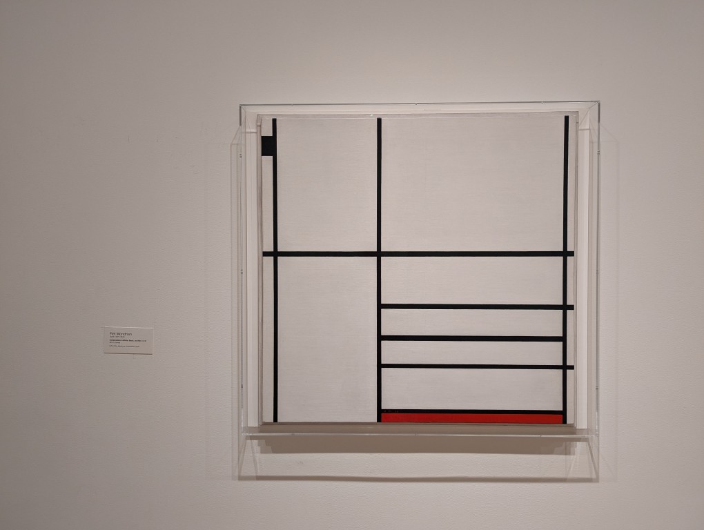 Painting of lines and colored rectangles by Piet Mondrian at MOMA.