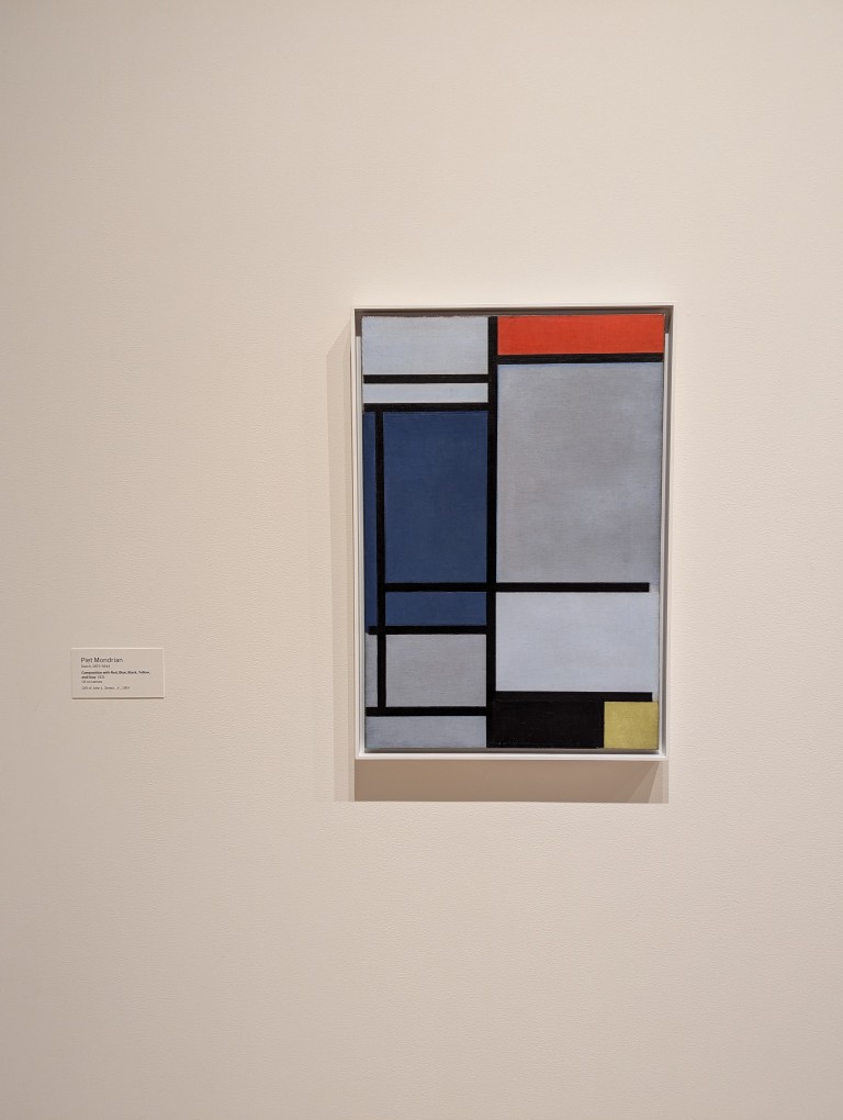 Painting of lines and colored rectangles by Piet Mondrian at MOMA.