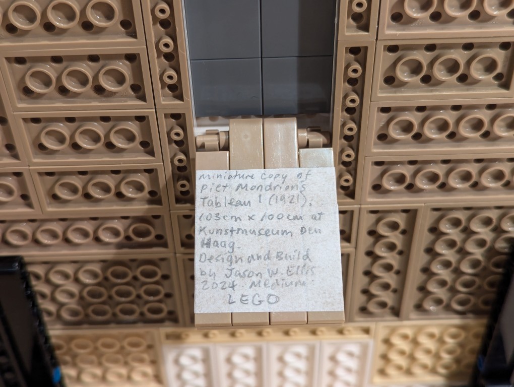 Artist statement on parchment pasted to inside of hidden compartment on LEGO Mondrian painting back
