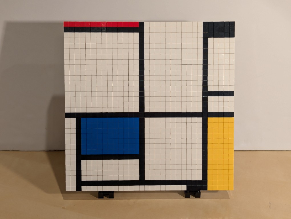 LEGO recreation of Mondrian's Tableau I--white canvas, black intersecting lines, rectangles of red, blue, yellow, and white.