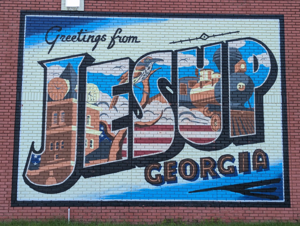 greetings from jesup georgia mural painted on a brick wall