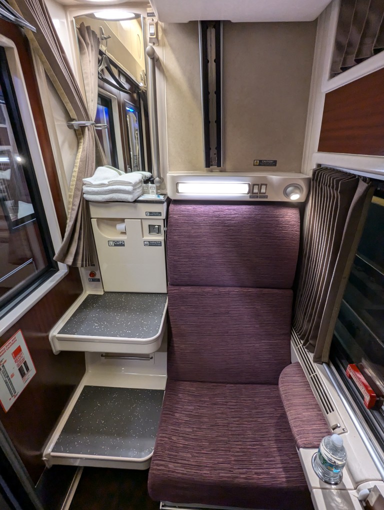 amtrak train roomette with seat and sink