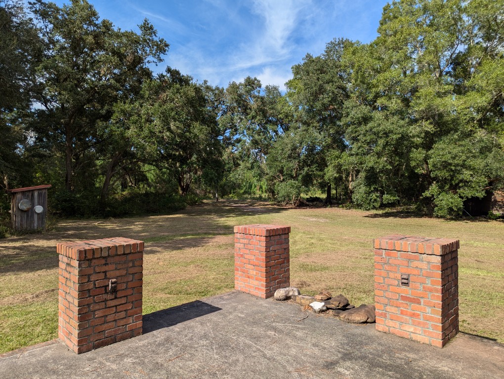 brick pilasters at the corner of the porch 