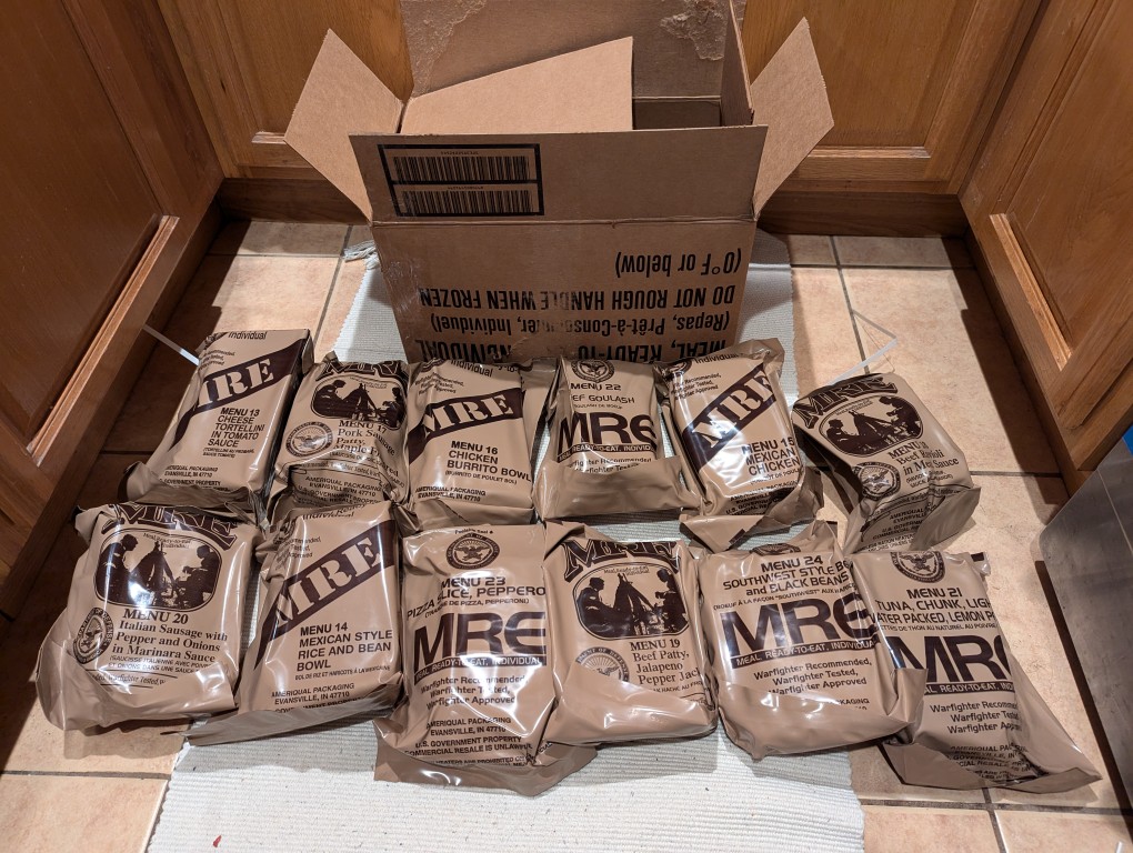 12 mres on the floor with their cardboard case in the background