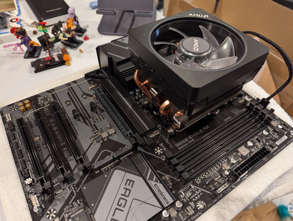 motherboard with cpu and cpu cooler mounted on top