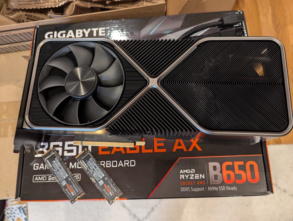 RTX 3090 video card and two nvme SSDs on a cardboard box