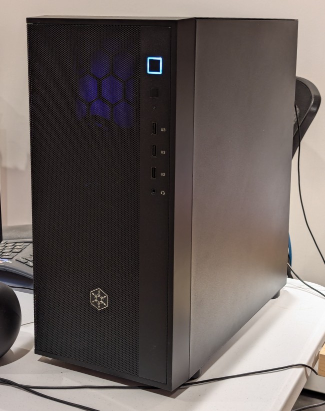 black midtower atx computer case on a desk