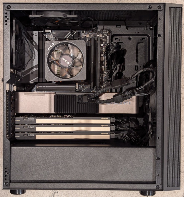 RTX 3090 and three A4000 video cards installed on ATX motherboard in a midtower PC case