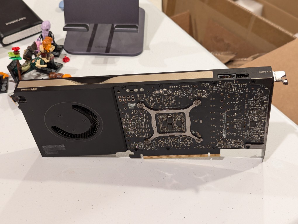 thin long single slot video card with a single blower fan back with circuit board exposed