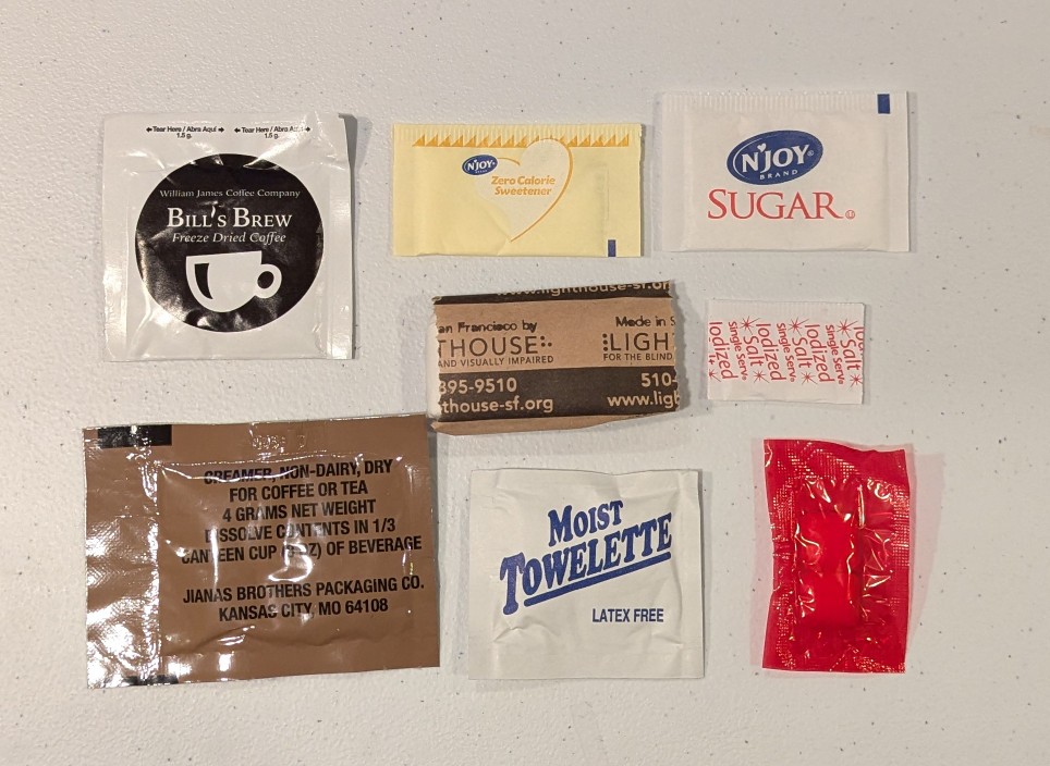 mre accessory packets of coffee, sugar, tp, and other items
