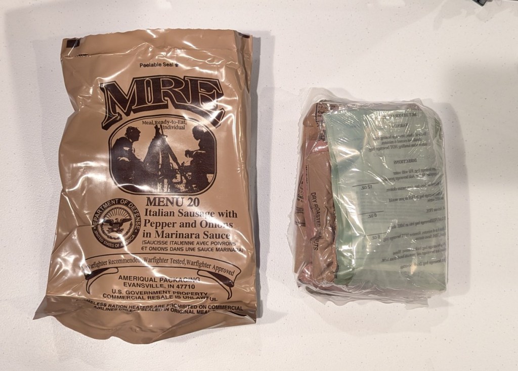 brown plastic bag for mre menu 20 next to a smaller clear plastic bag with mre food contents