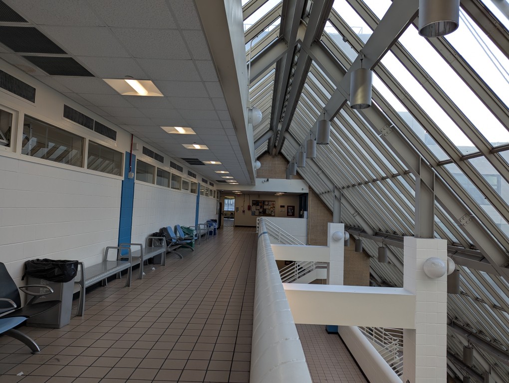 multilevel walkways under glass roof in highrise building