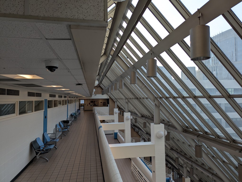 multilevel walkways under glass roof in highrise building