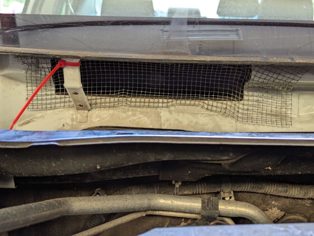 wire mesh pushed into and over the cabin air intake