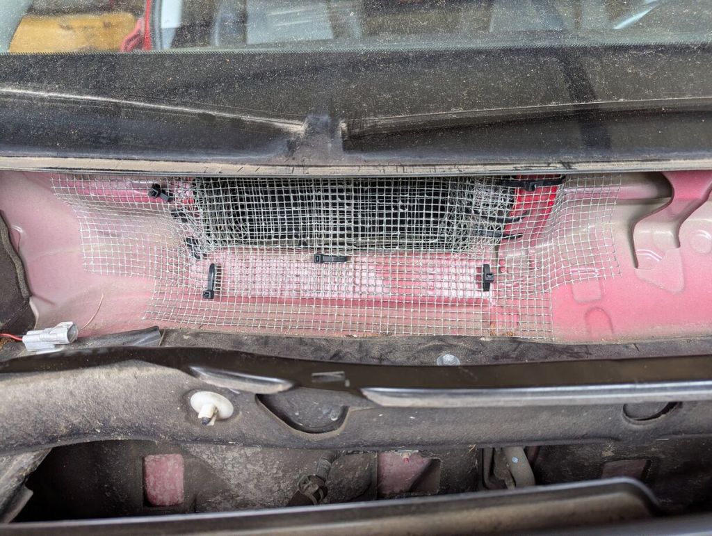 metal mesh covering cabin air intake