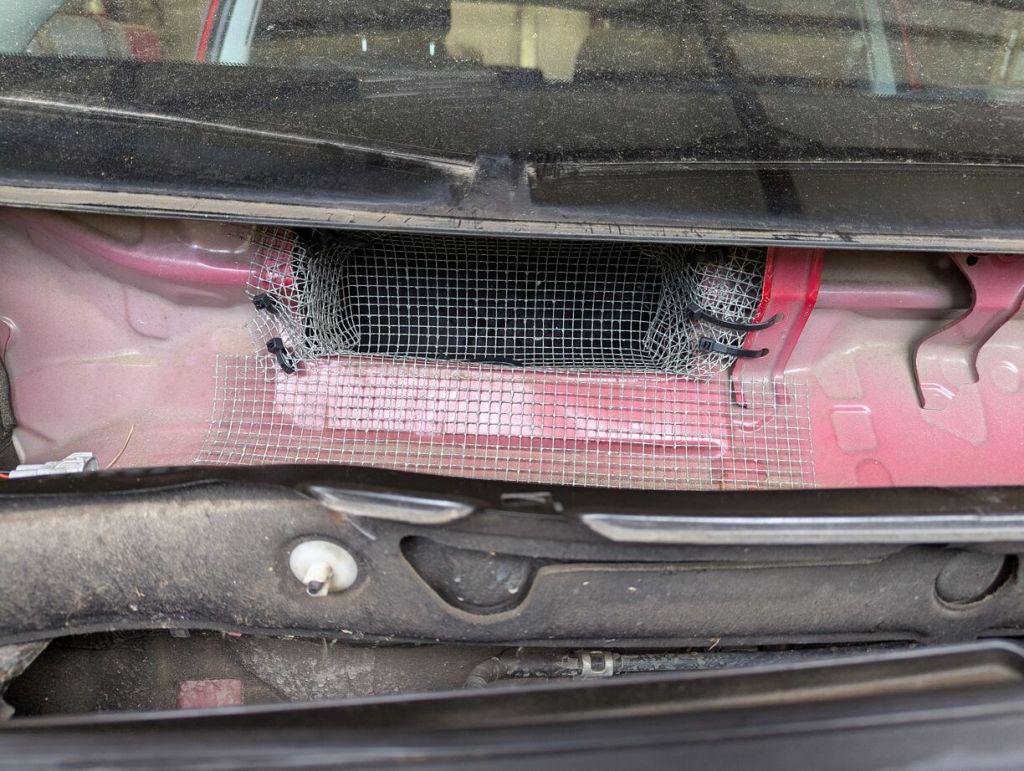 metal mesh covering cabin air intake