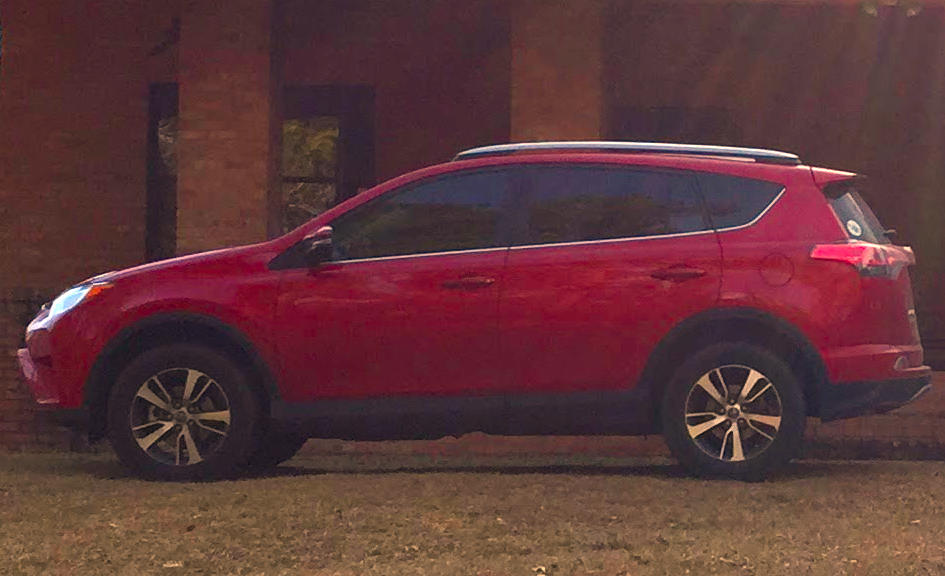side view of a red 2017 Toyota RAV4 SUV