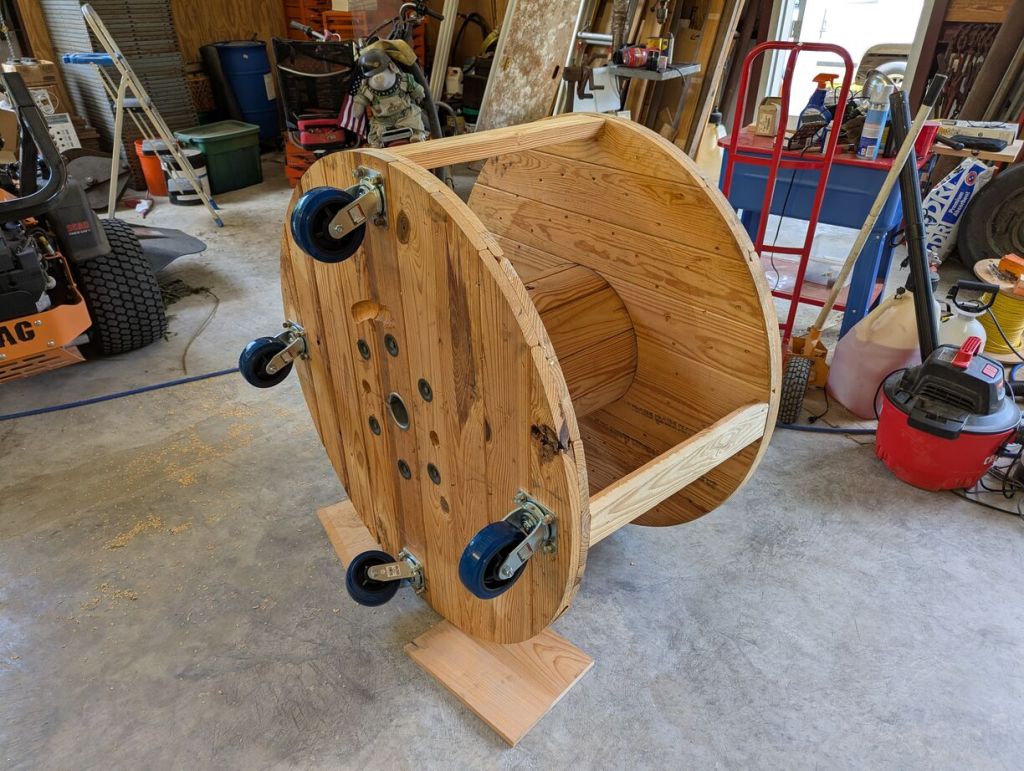round wood workbench on wheels on its side