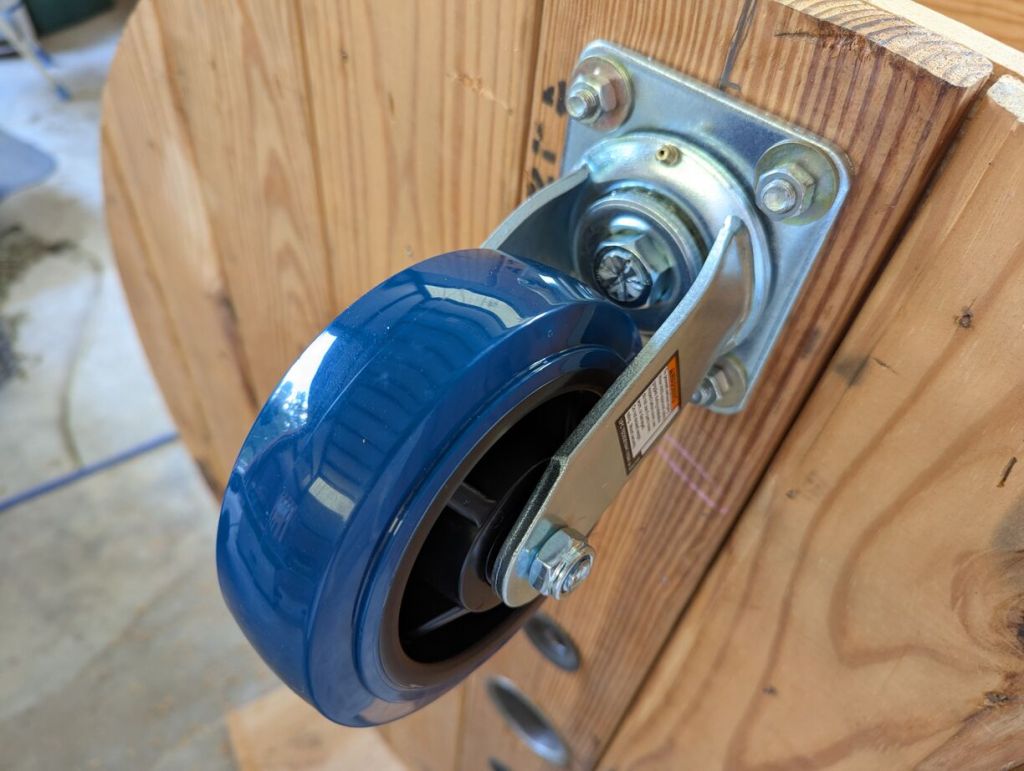 caster wheel installed with one set of nuts before locking nuts installed