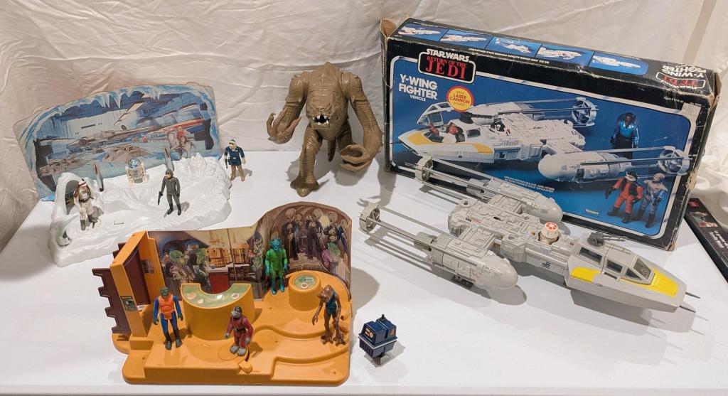 vintage star wars action figures arranged for display on a table