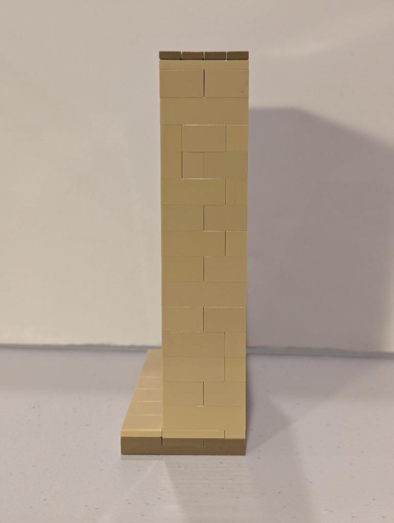 Han Solo in Carbonite displayed in an alcove of Jabba's Palace built out of tan LEGO bricks.