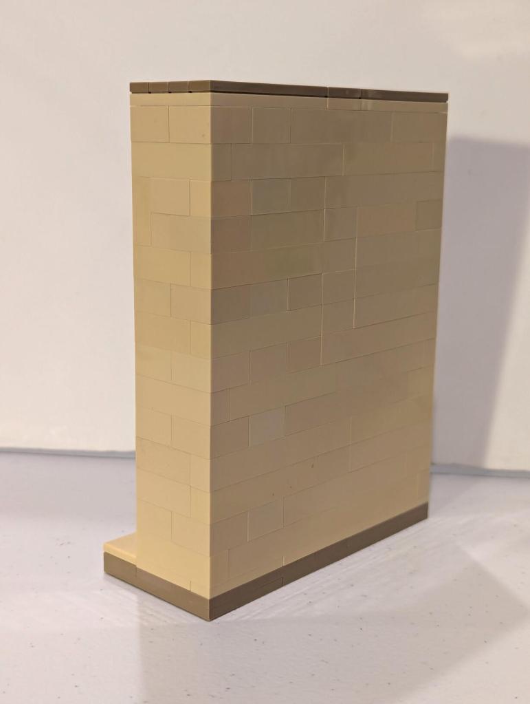 Han Solo in Carbonite displayed in an alcove of Jabba's Palace built out of tan LEGO bricks.